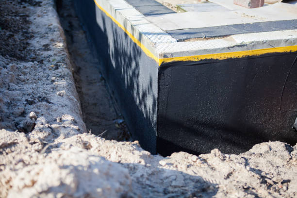 Professional Basement Waterproofing technician working in Madison, WI